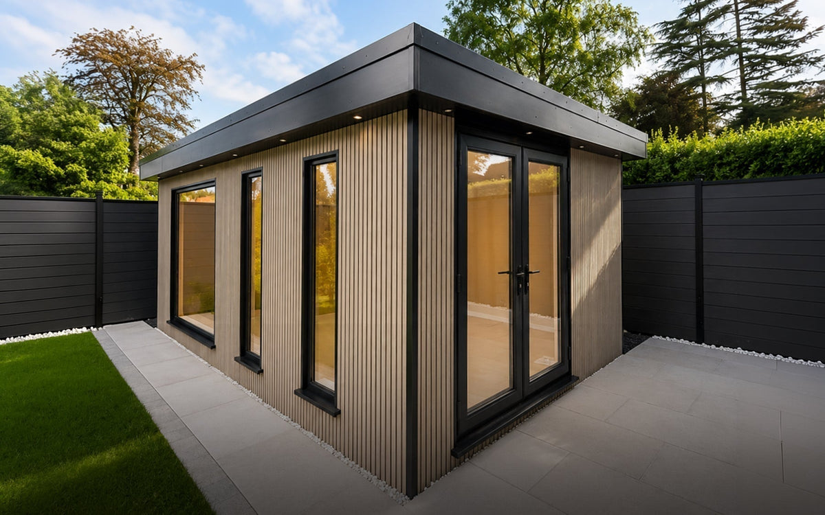 Bramhall garden room with NeoTimber Ash White slatted composite cladding, porcelain patio and lawn.