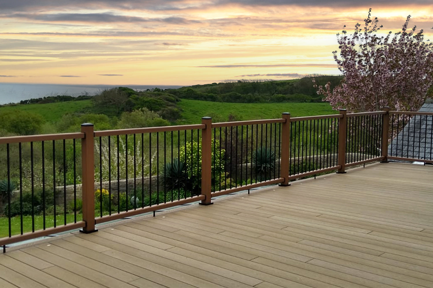 Teak composite balustrades and deluxe decking installed on a balcony with scenic views