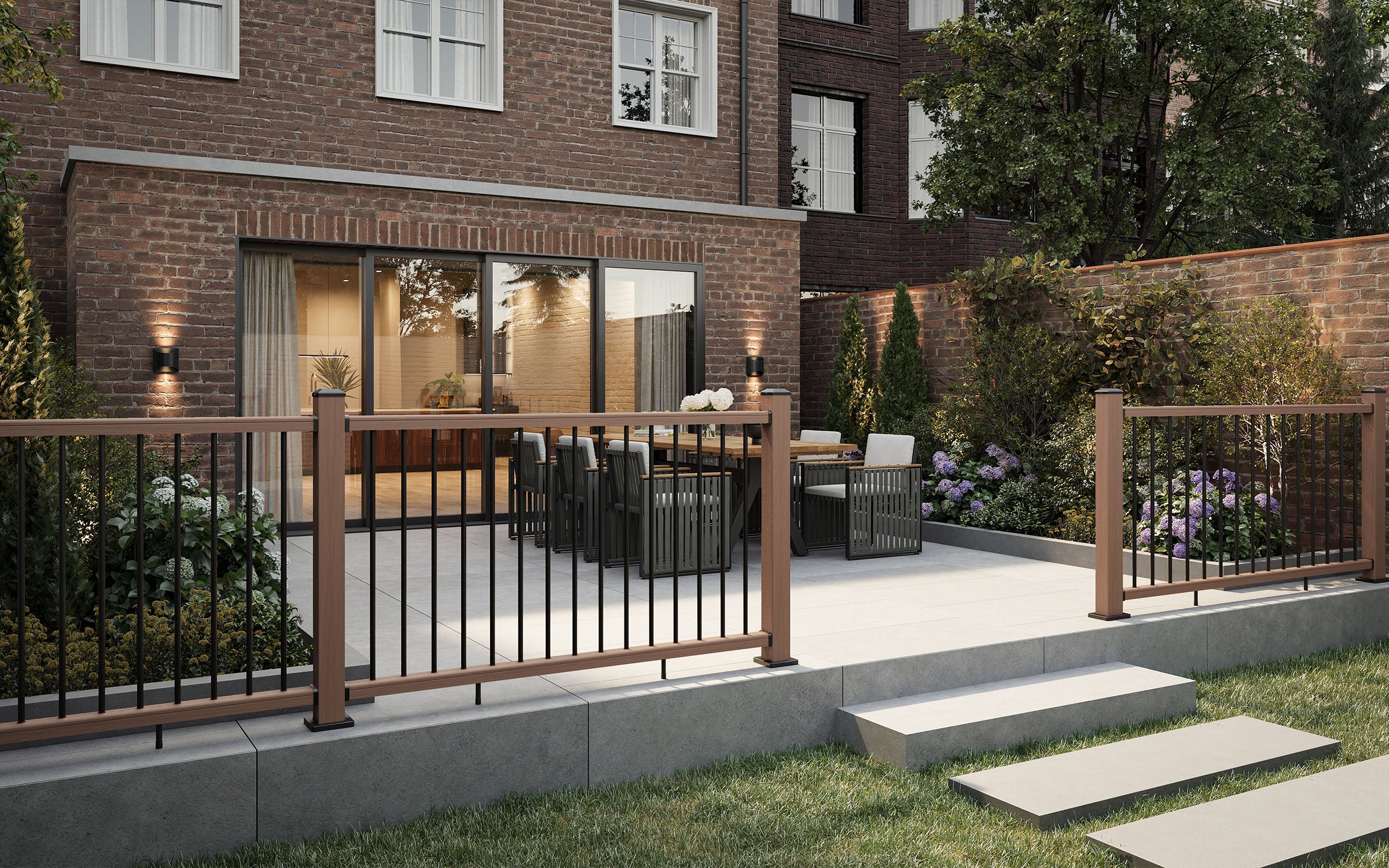 outdoor patio area with a brick building, composite balustrade, outdoor furniture, and garden.