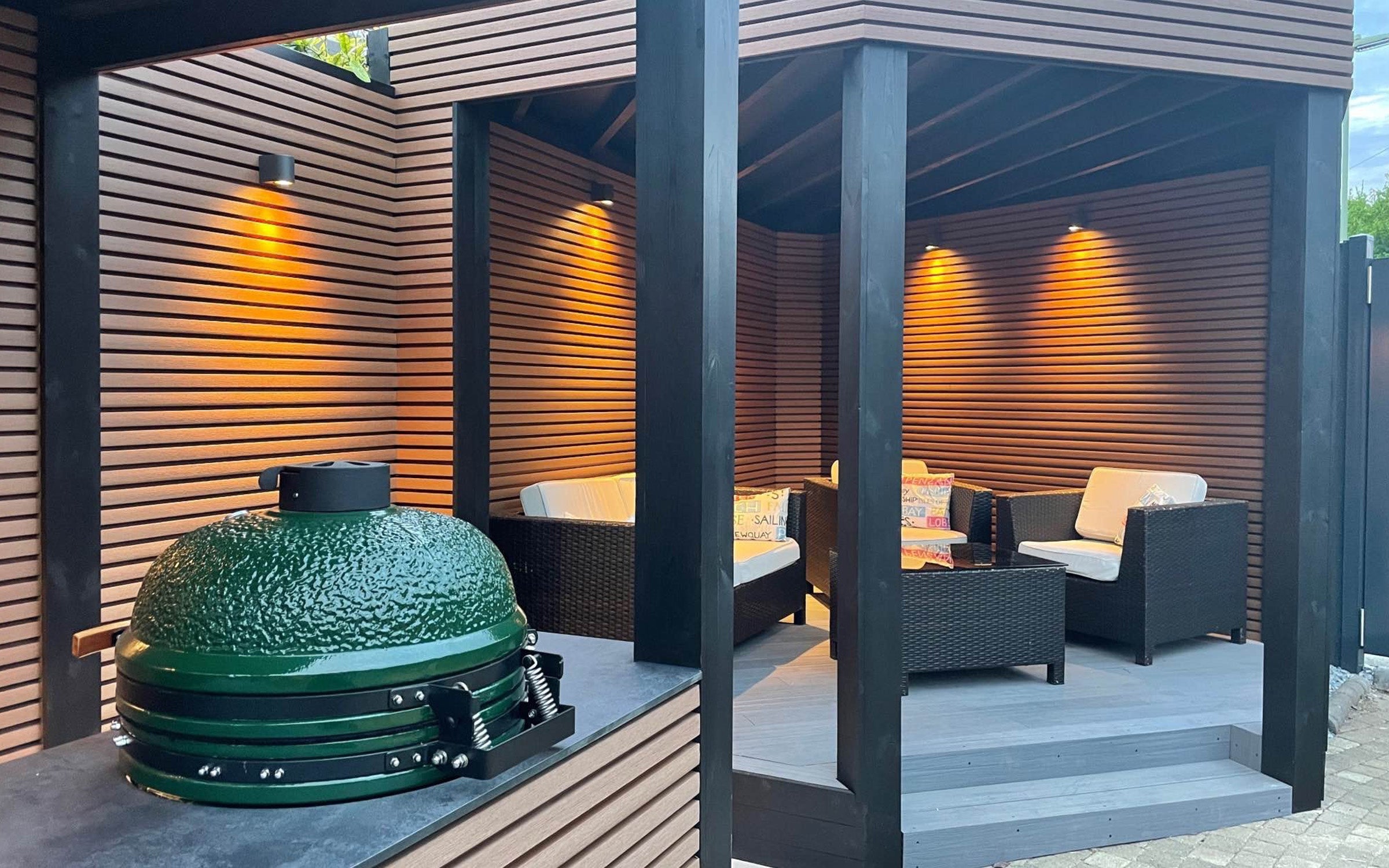 outdoor patio area with composite cladding, barbecue grill and garden seating
