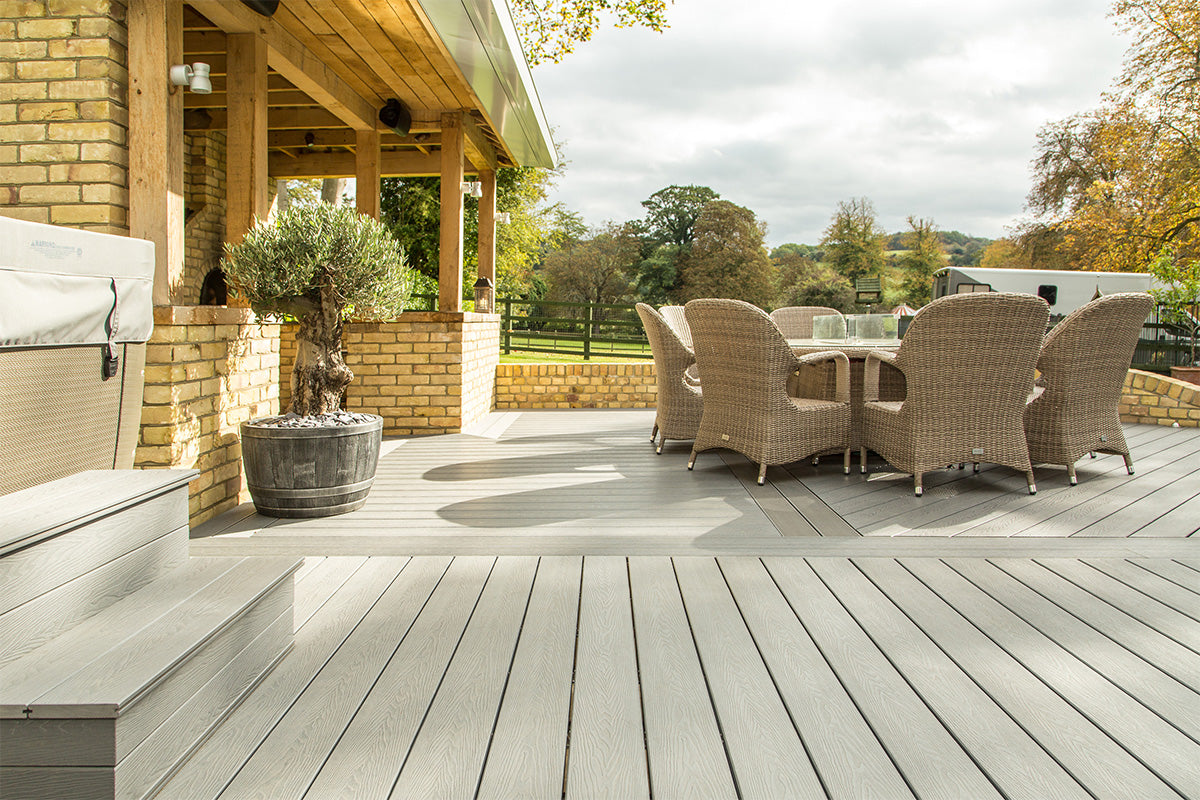 outdoor patio with neotimber composite deck, furniture, and grill area