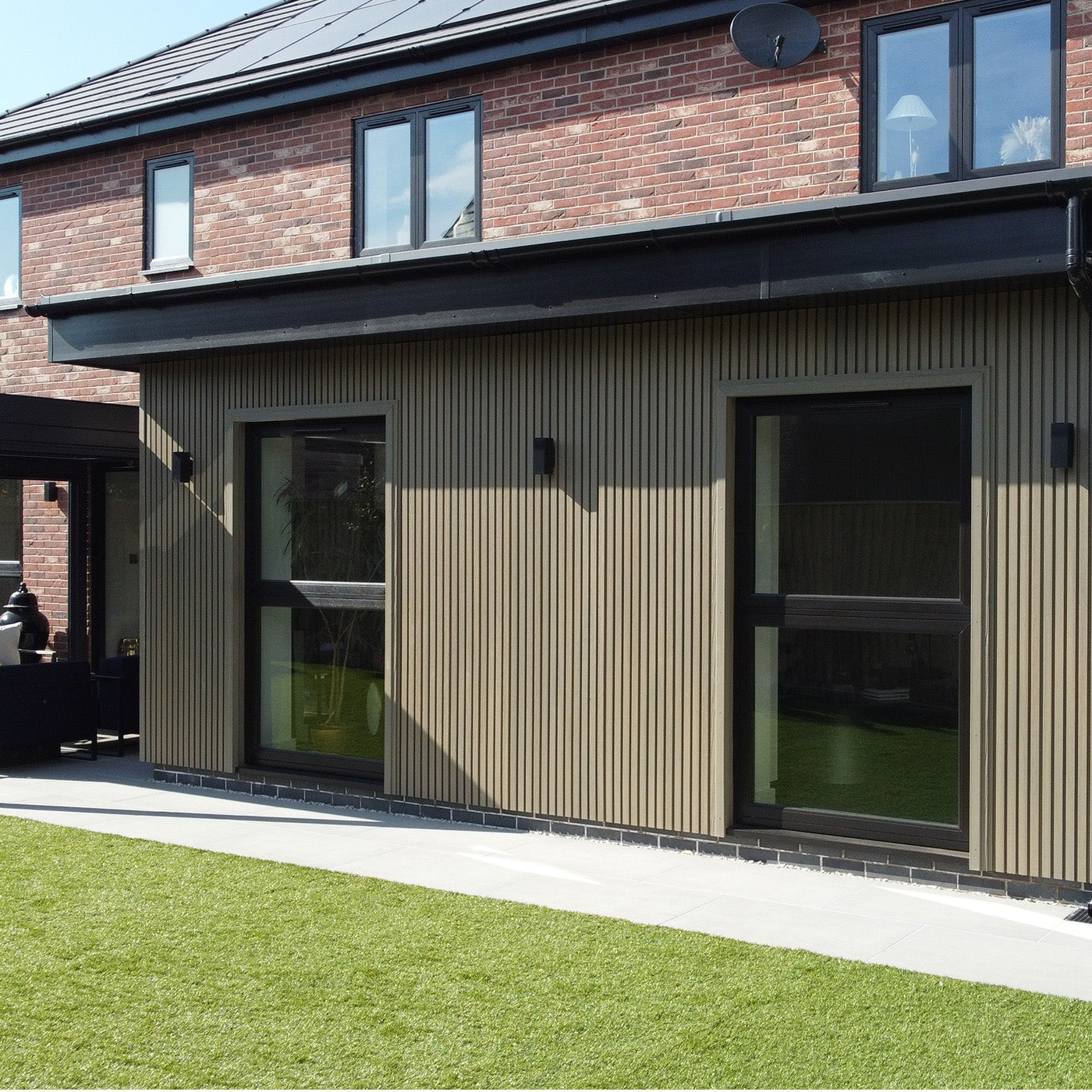 modern house exterior with brick and composite cladding panel design