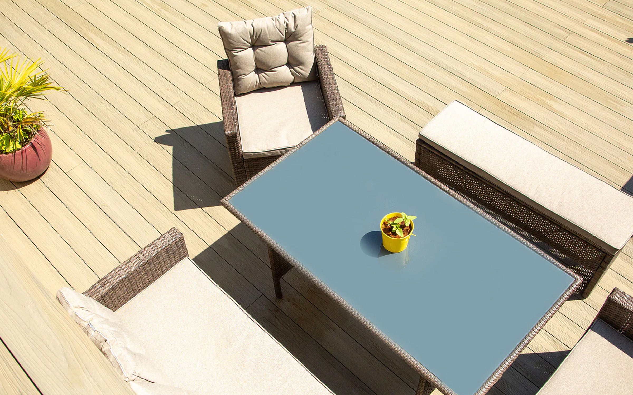 outdoor dining area finished with NeoTimber decking, creating a stylish and practical entertaining space