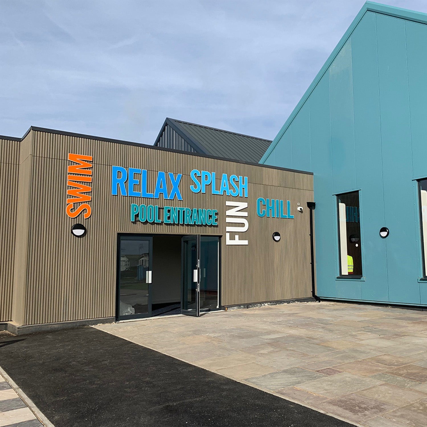 NeoTimber® antique slatted composite cladding installed at the entrance of a popular leisure centre