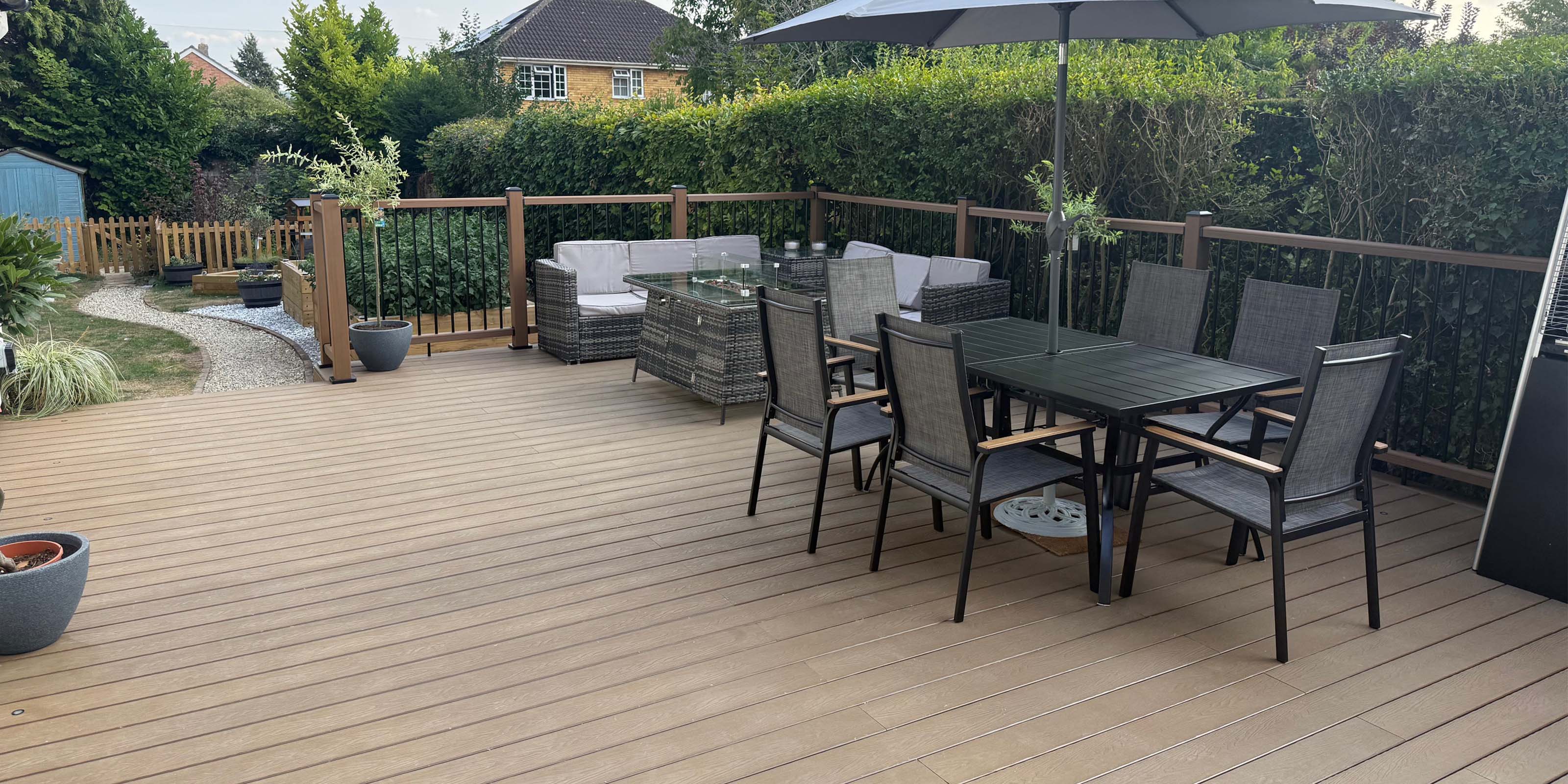 outdoor patio area with furniture on a modern composite deck