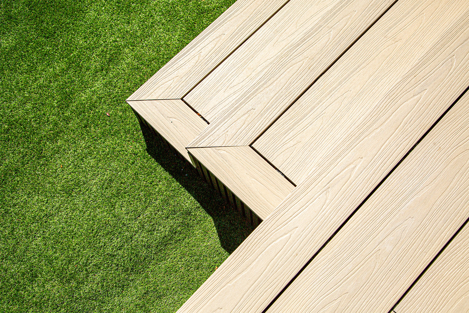 composite deck edge on a grassy lawn