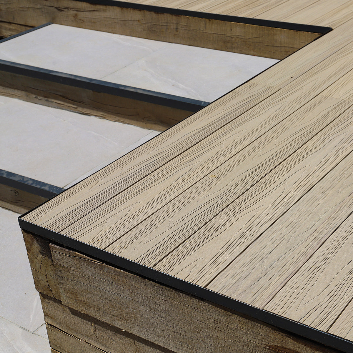 close-up of composite decking with decorative metal edging detail