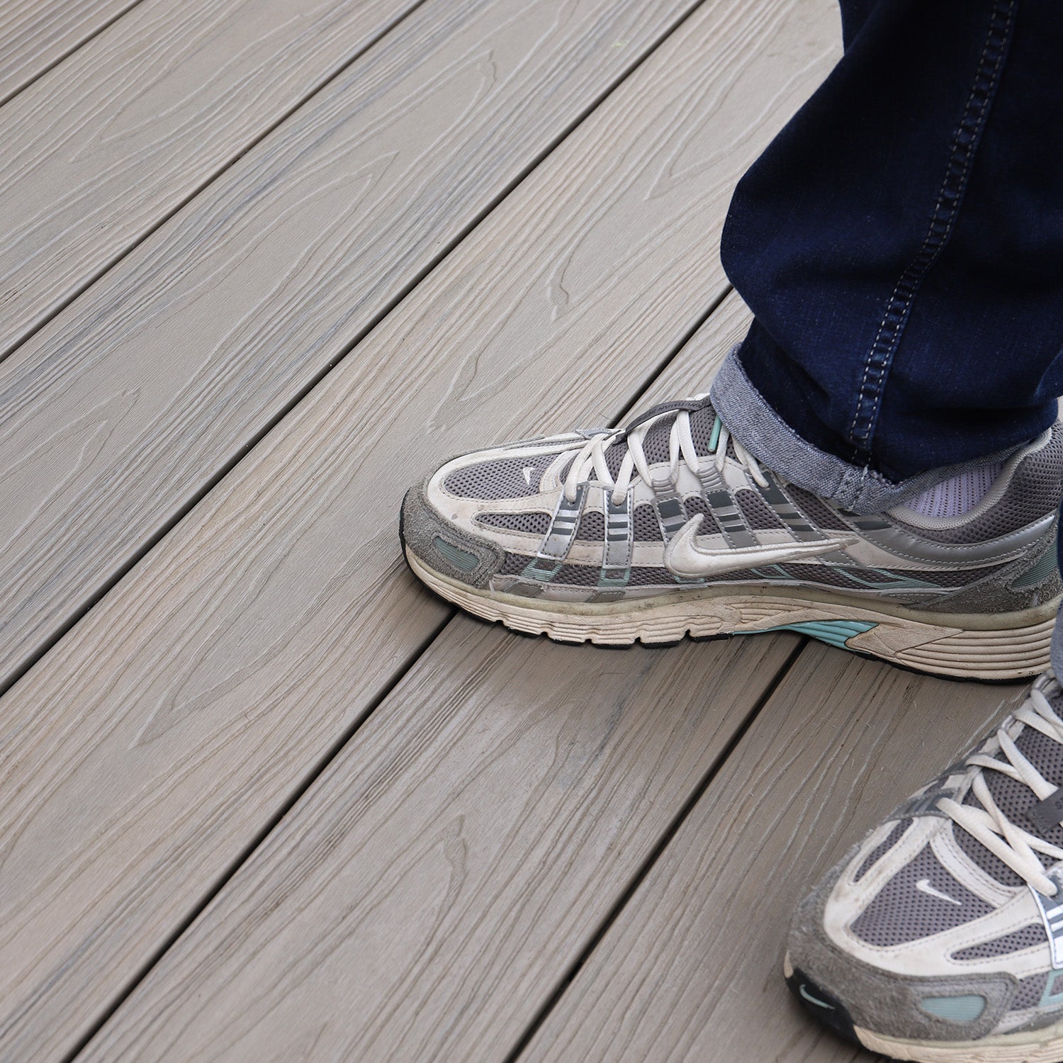 sports shoes standing on modern composite deck boards