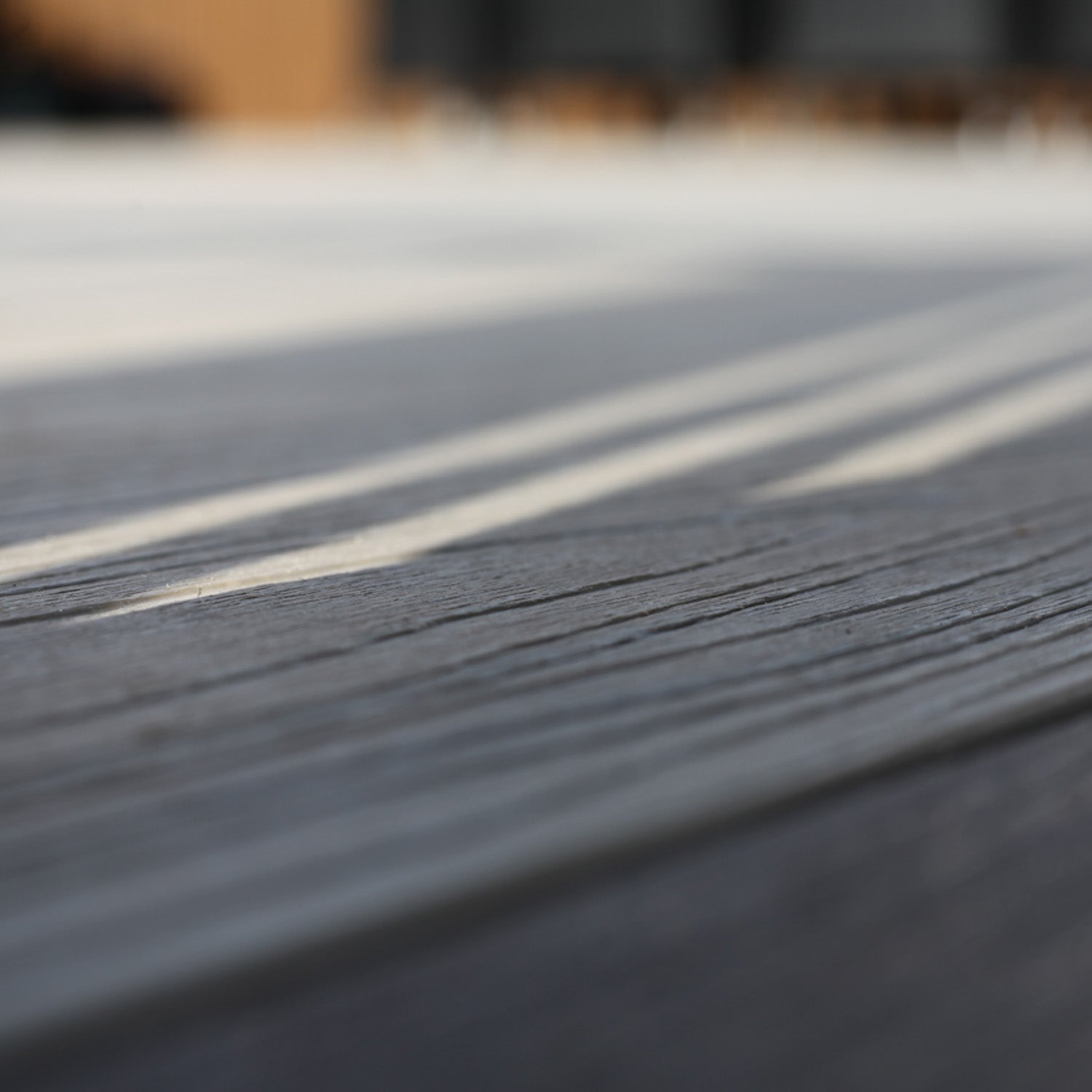 close-up of a neotimber decking surface with blurred background