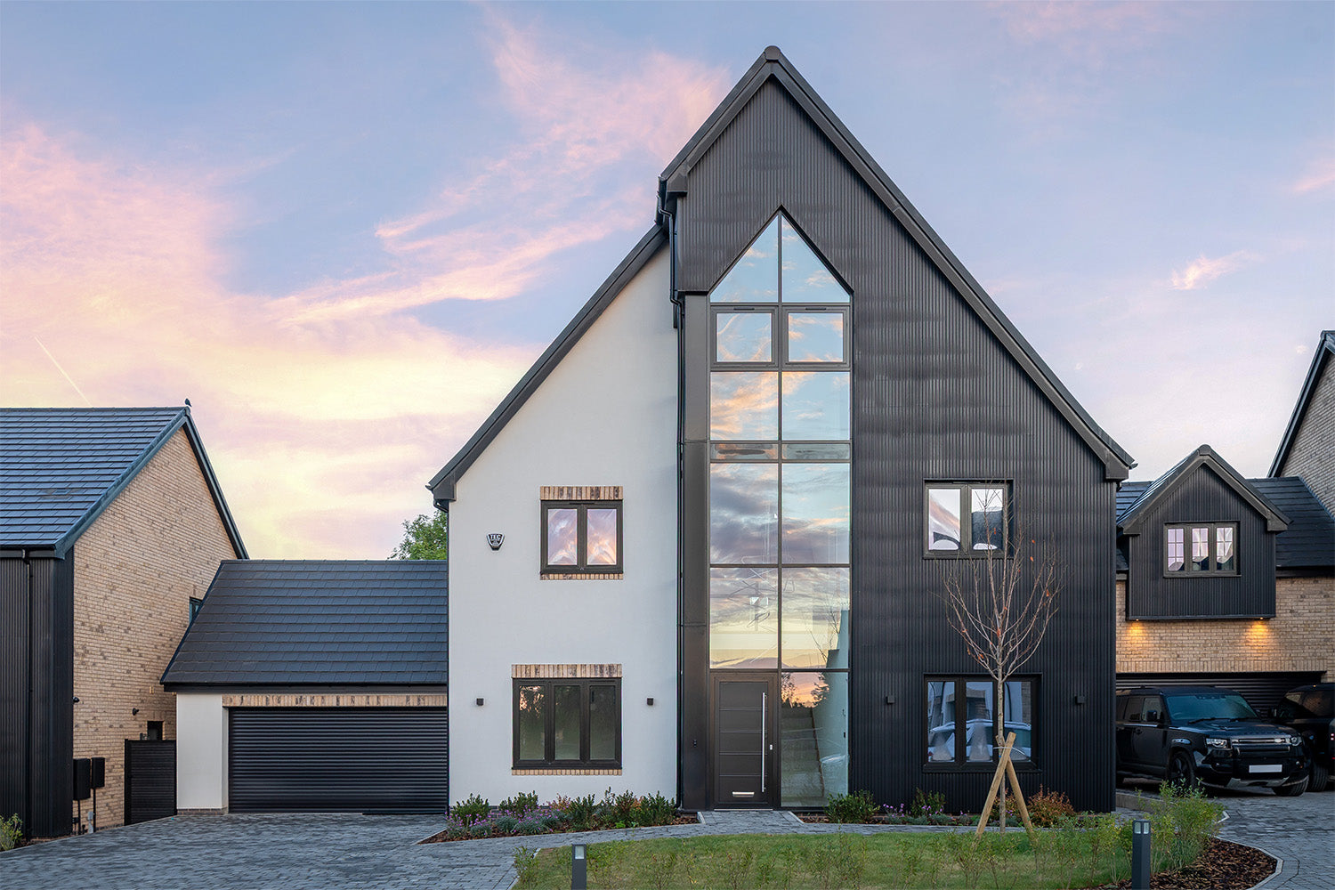 NeoTimber® Charcoal Slatted Composite Cladding Installed on Modern Luxury House Front