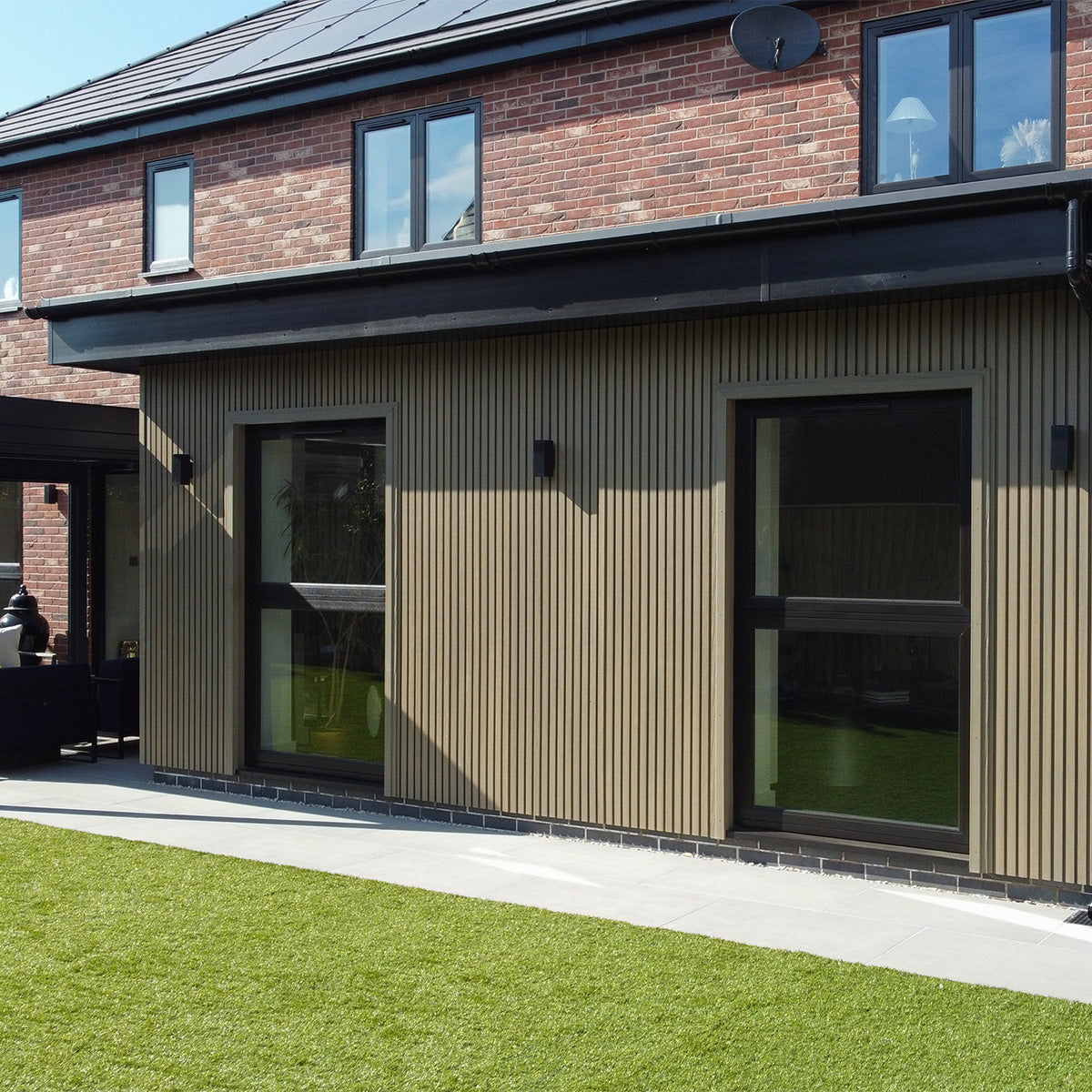 modern house exterior with brick and composite cladding panel design