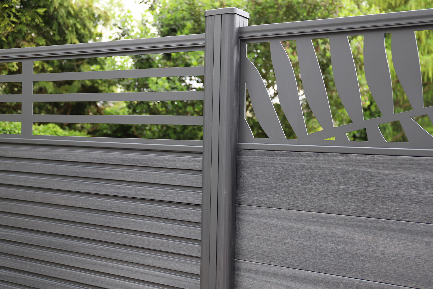 Grey NeoTimber composite fencing  fence with decorative top rail in a garden setting