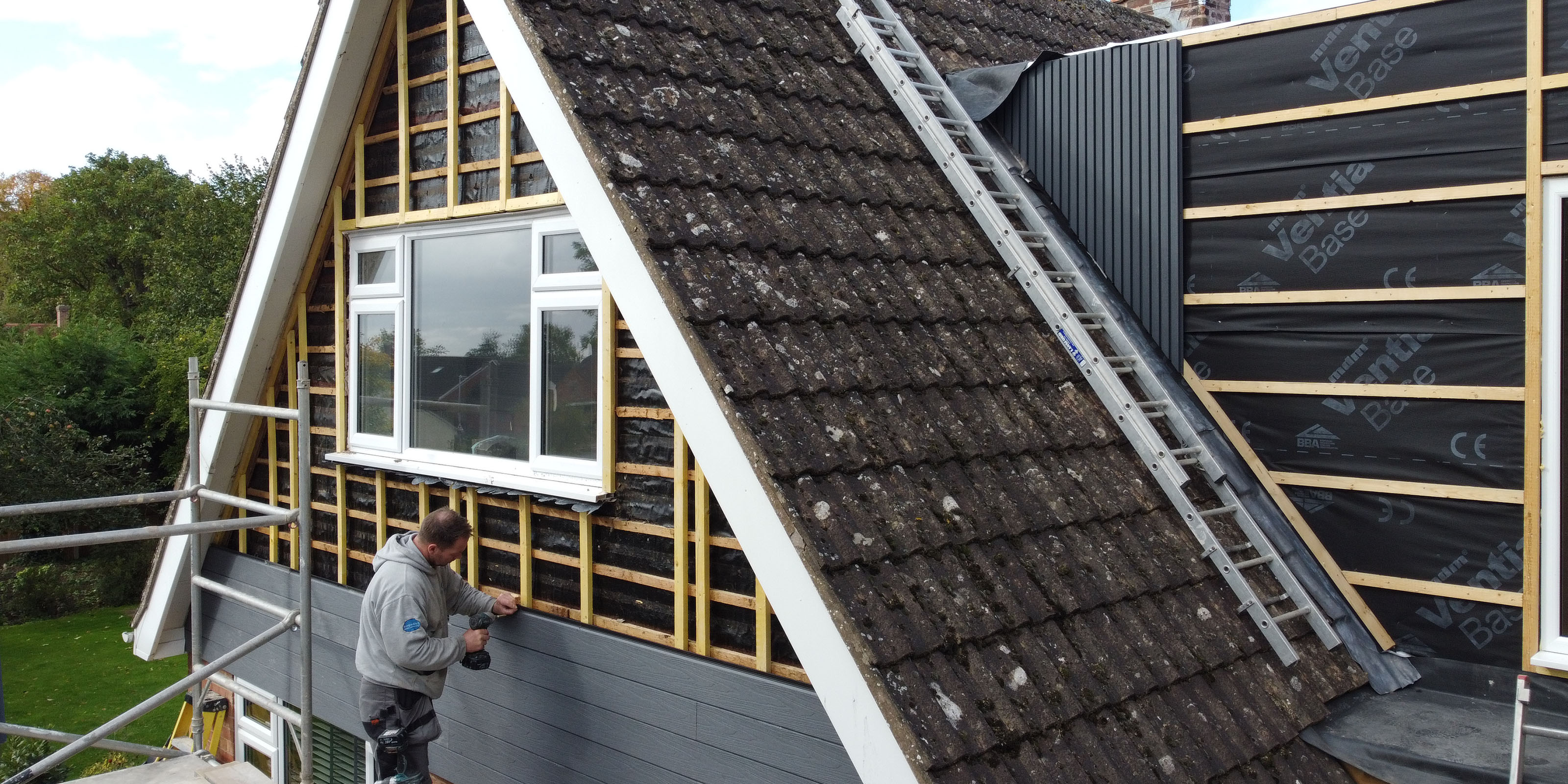Installer Fitting NeoTimber Composite Cladding To A Residential Property Exterior