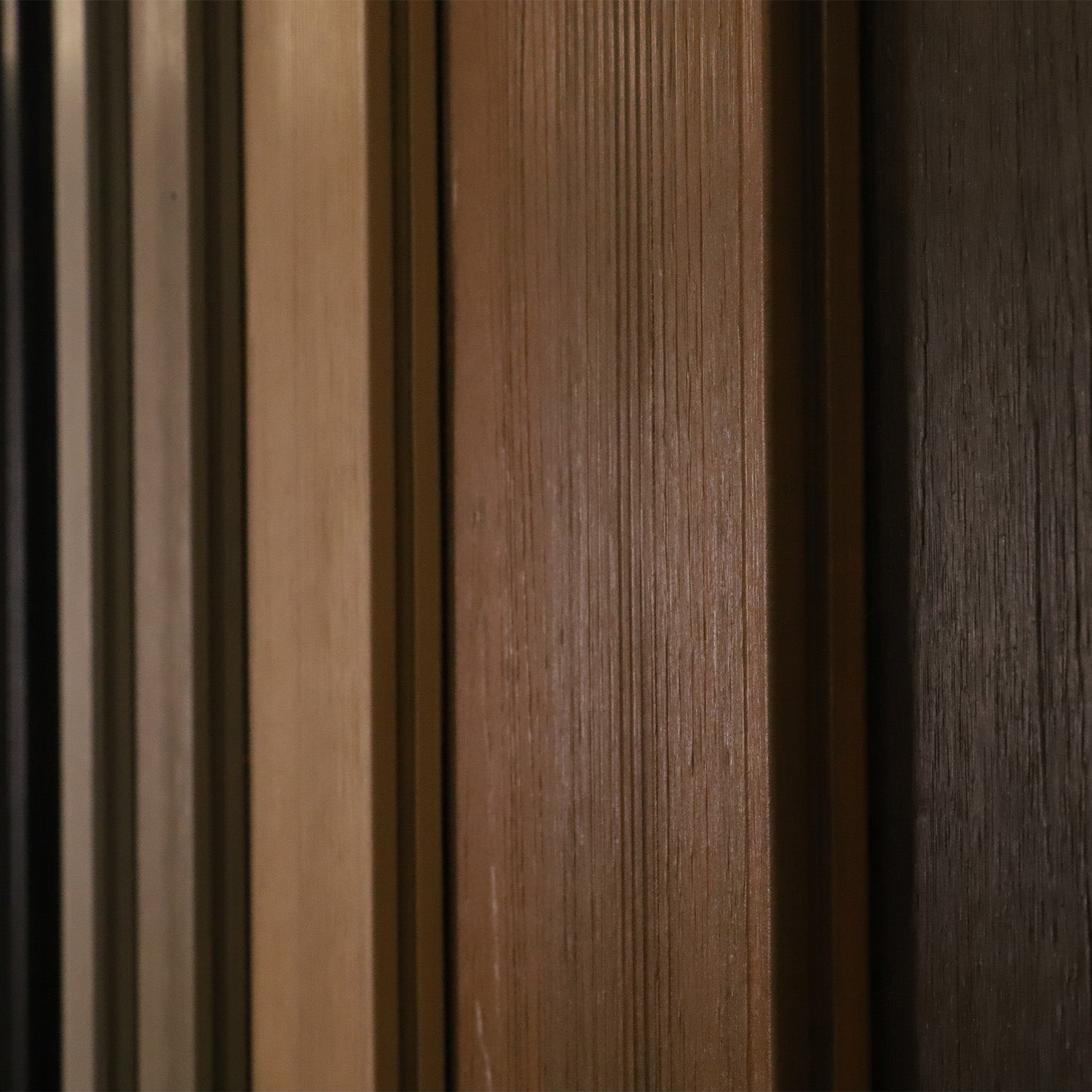close-up of neotimber composite planks in various shades of brown
