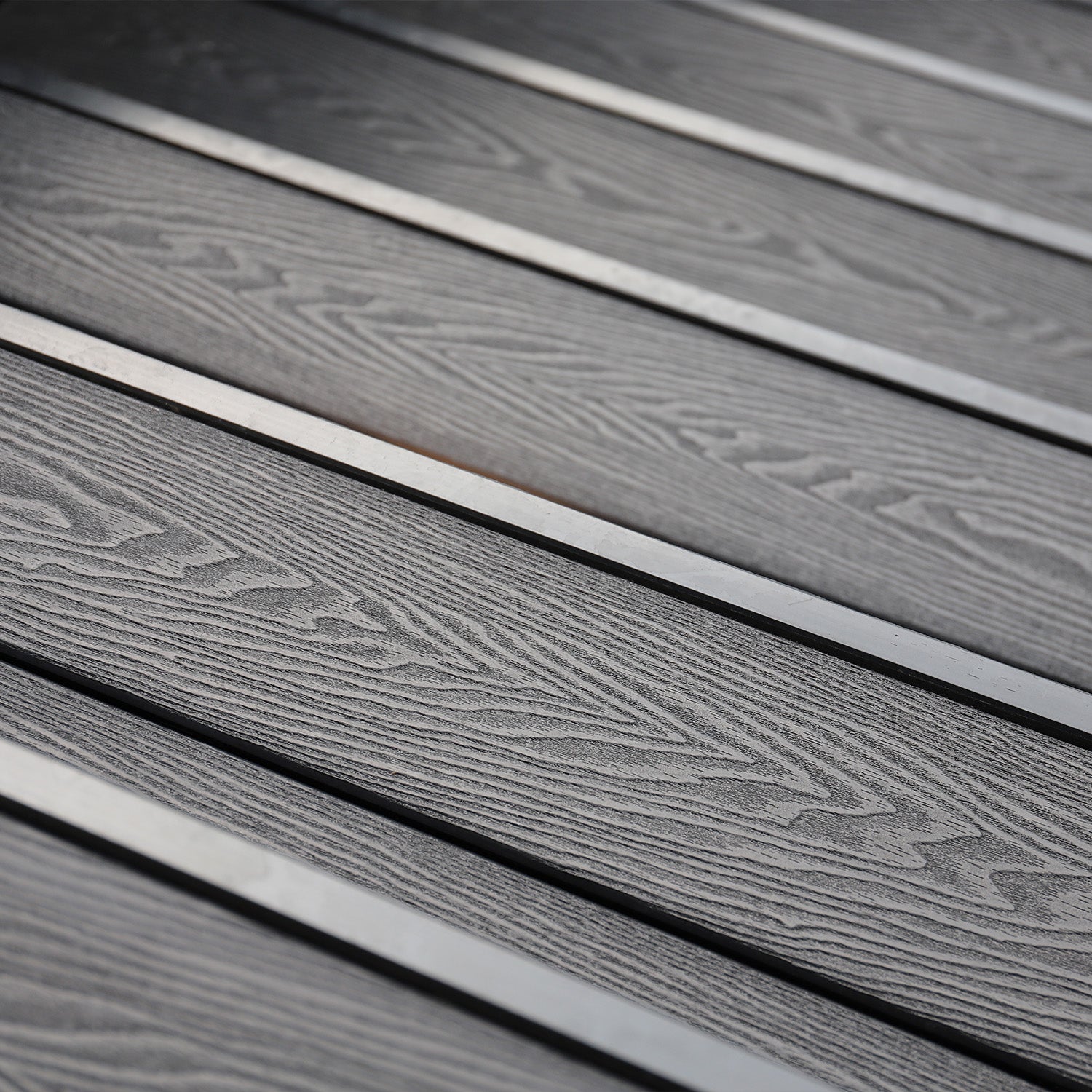 close-up of grey composite decking with a focus on texture and pattern