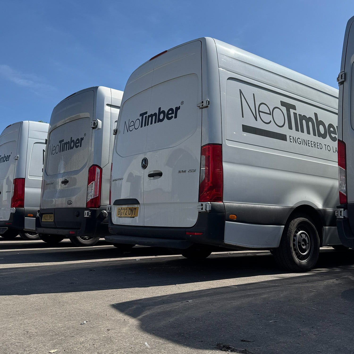 neotimber vans parked in a row on a clear day