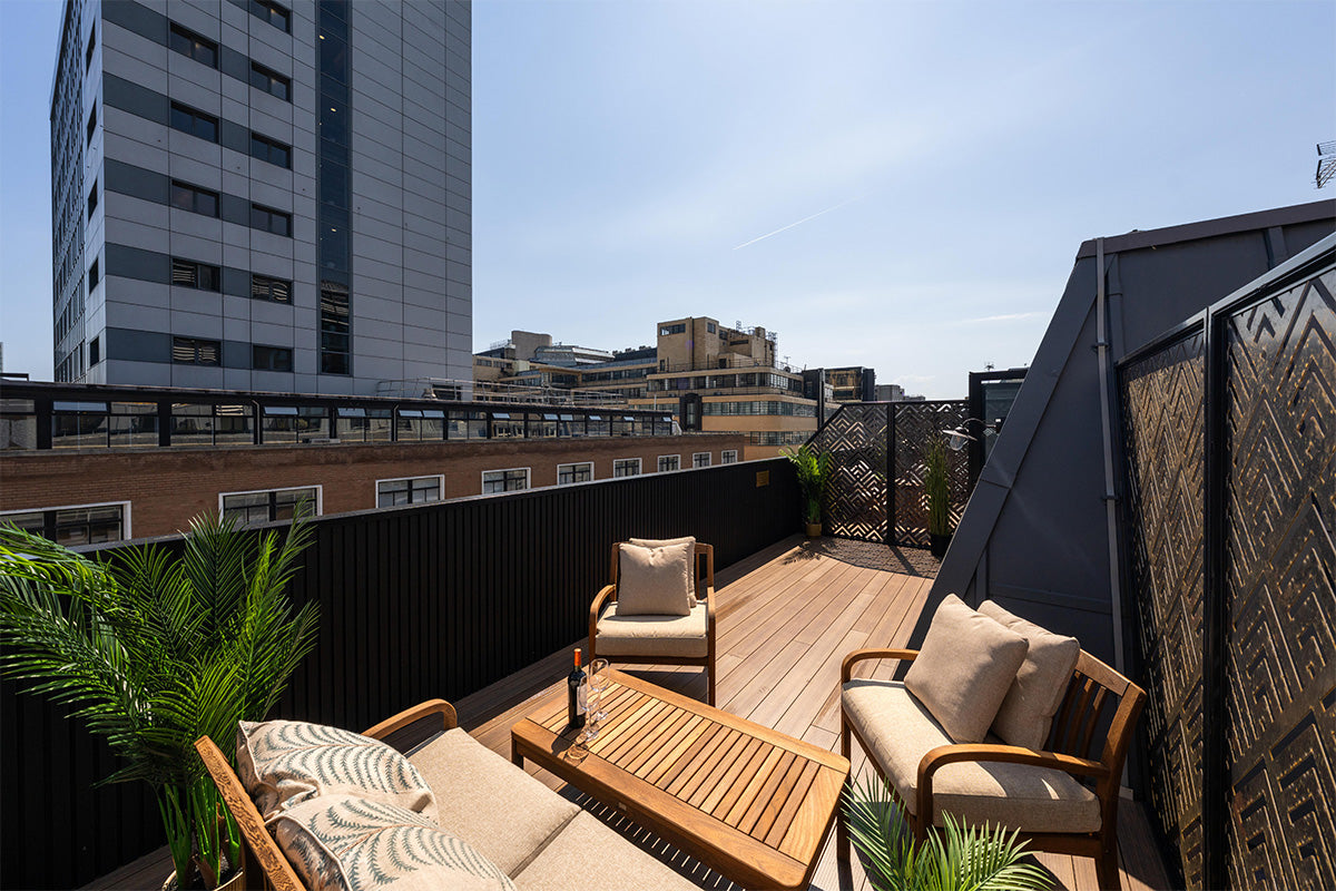 rooftop aluminium deck with outdoor furniture and greenery