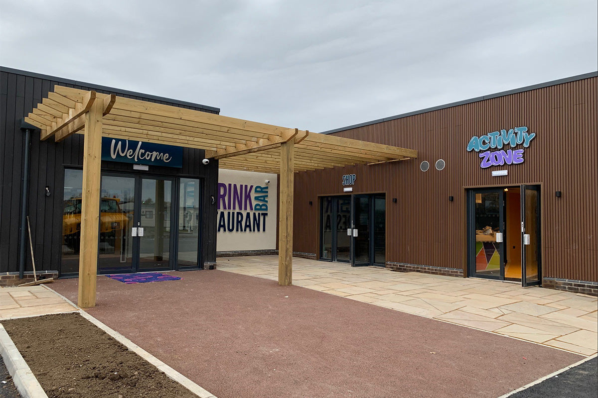 neotimber slatted composite cladding installed alongside a timber pergola
