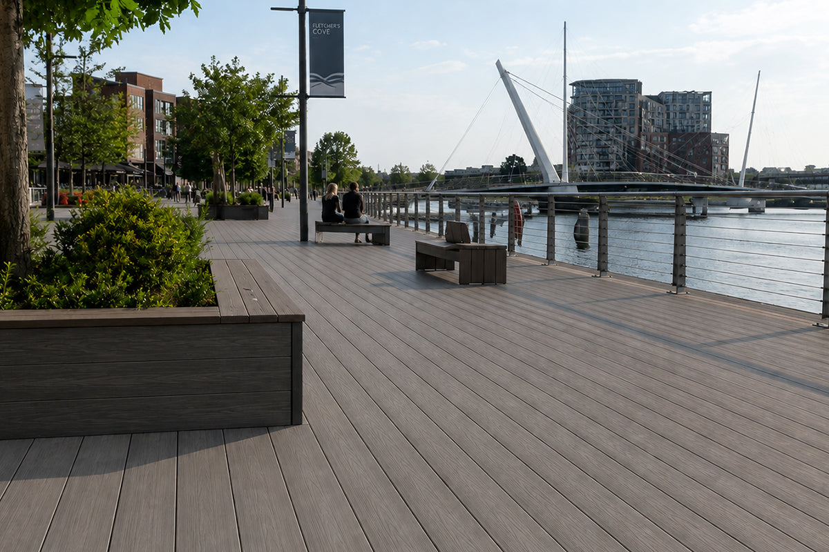neotimber outdoor composite deck by a waterfront with people and greenery