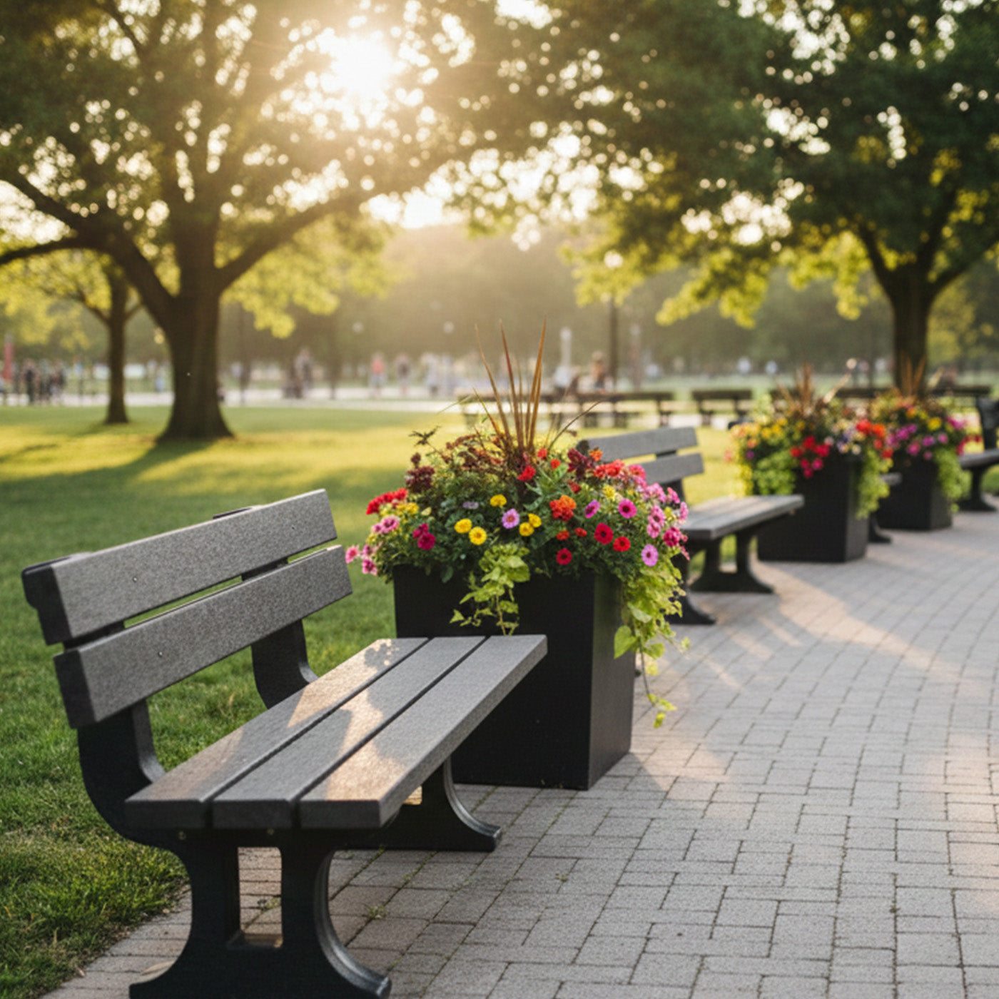 neotimber recycled plastic bench and flower pots in a park with sunlight filtering through trees