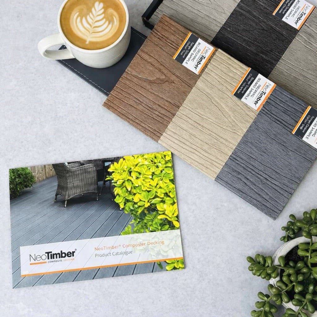 neotimber decking samples with a cup of coffee and product catalog on a light surface