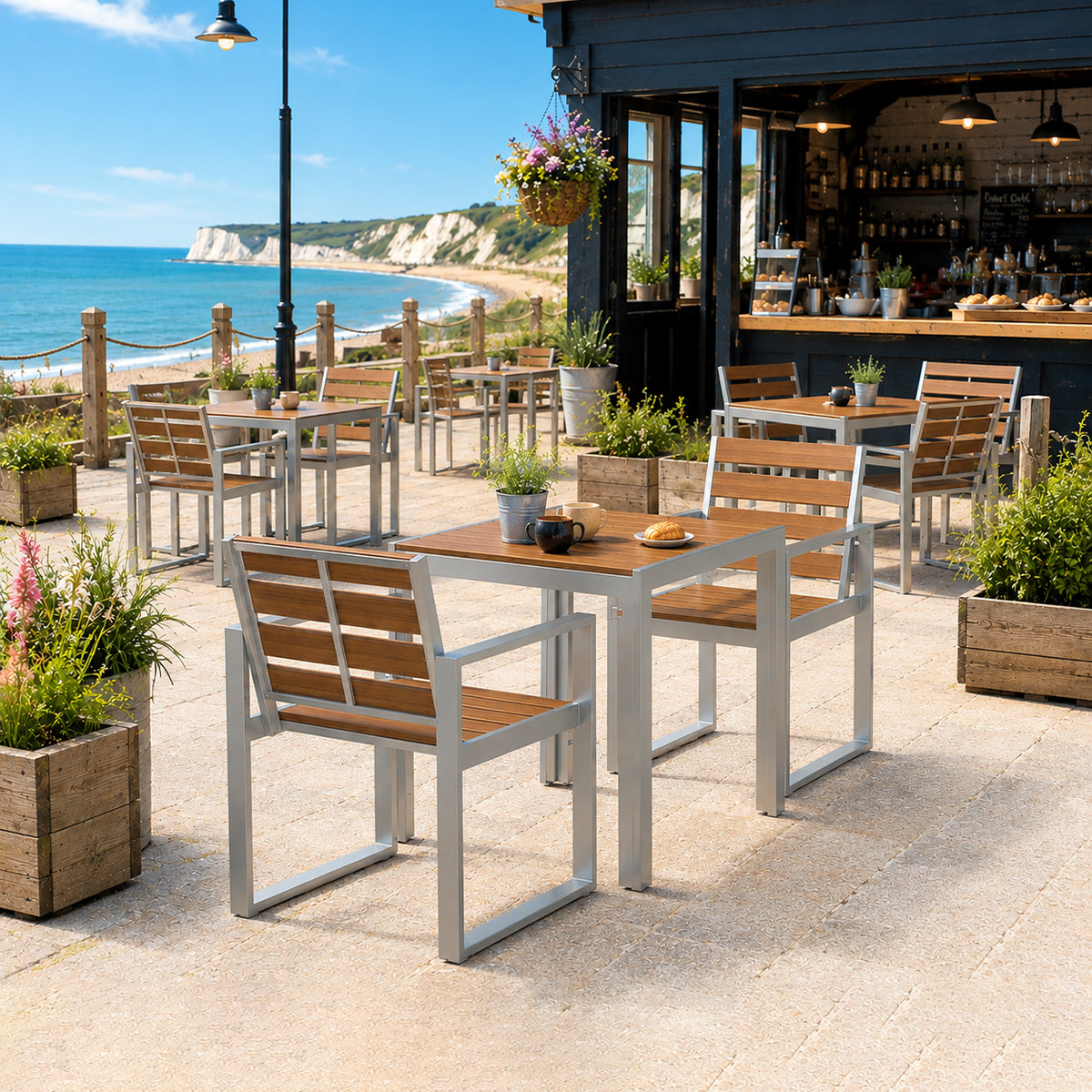 outdoor composite dining area with tables and chairs by a coastal bar