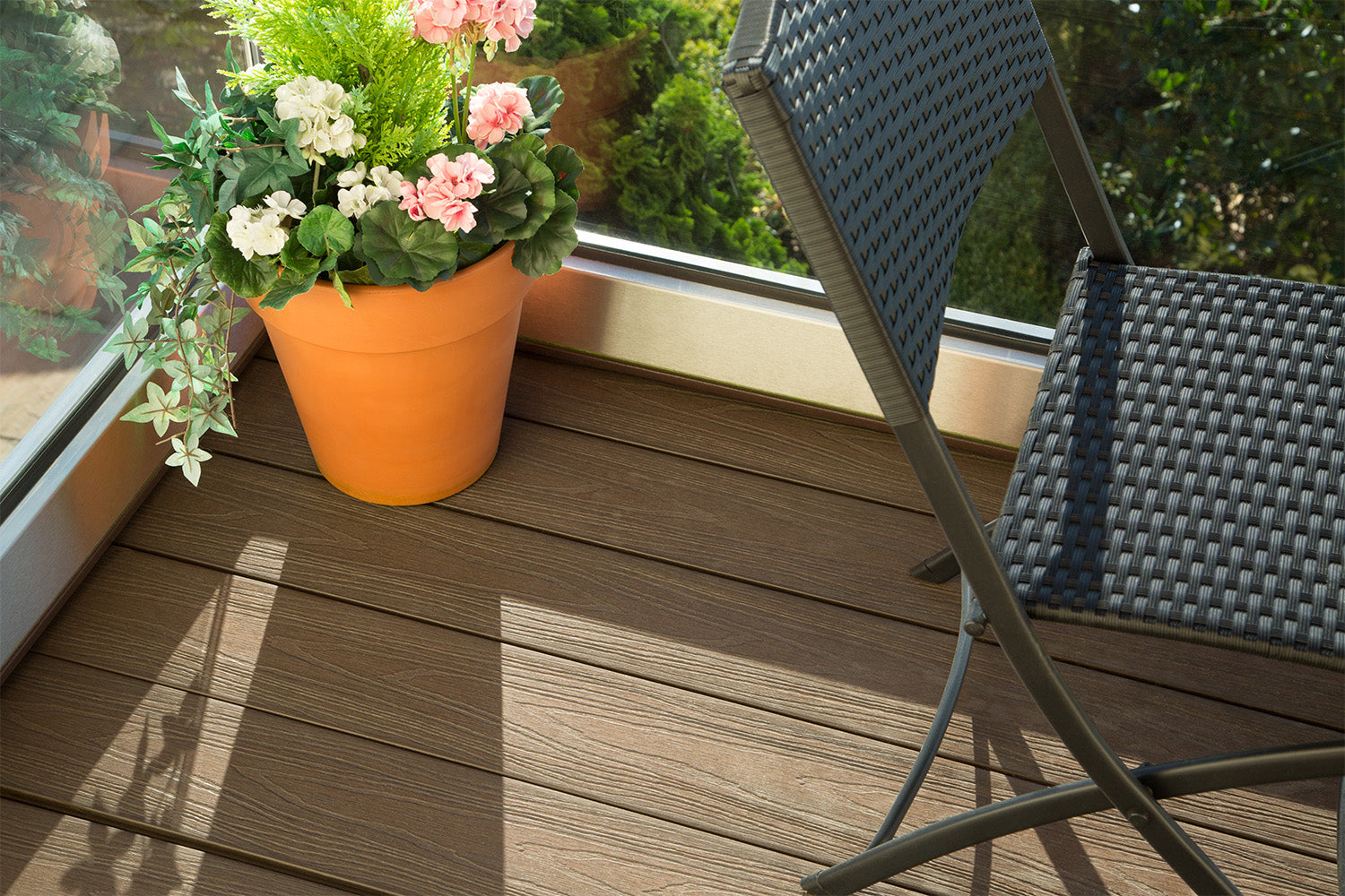 Potted Plant On NeoTimber Chocolate Composite Decking With Balcony Seating Area