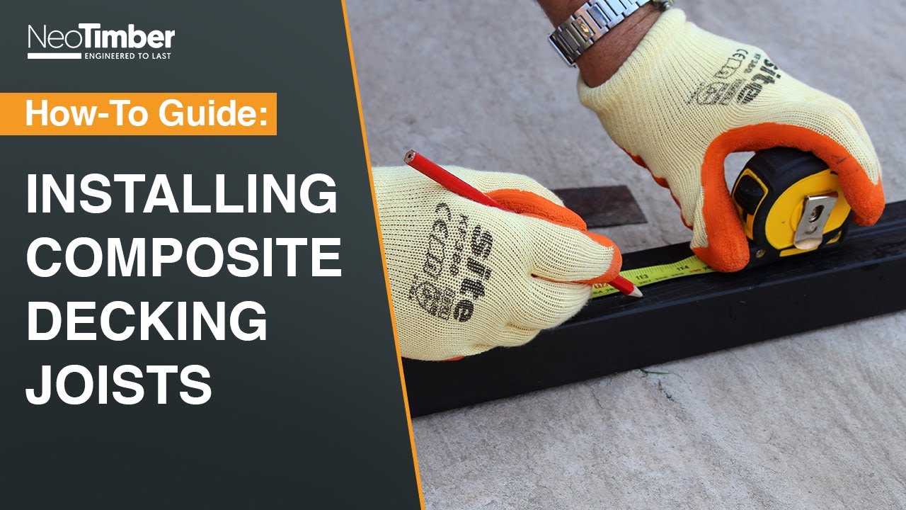 composite decking joist installation guide showing an installer using tools and protective gloves