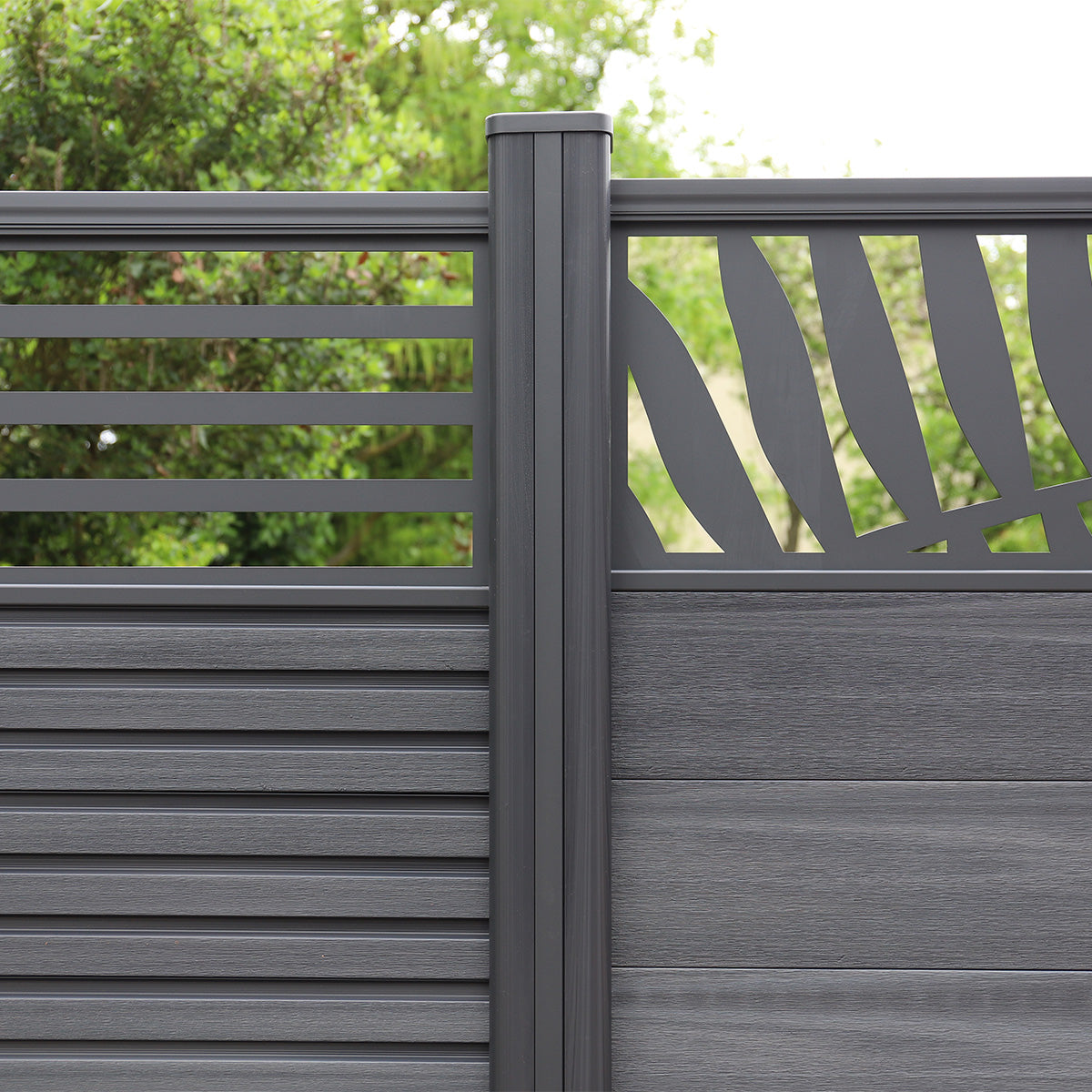 neotimber grey composite fence with decorative lattice design against a blurred green background