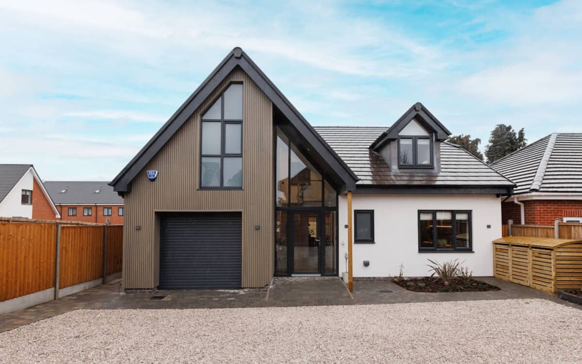 The composite wood cladding colours are popular as seen on this beautiful Deluxe teak cladding and stone home. 