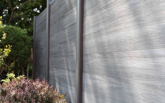 composite fencing with plants along the edge