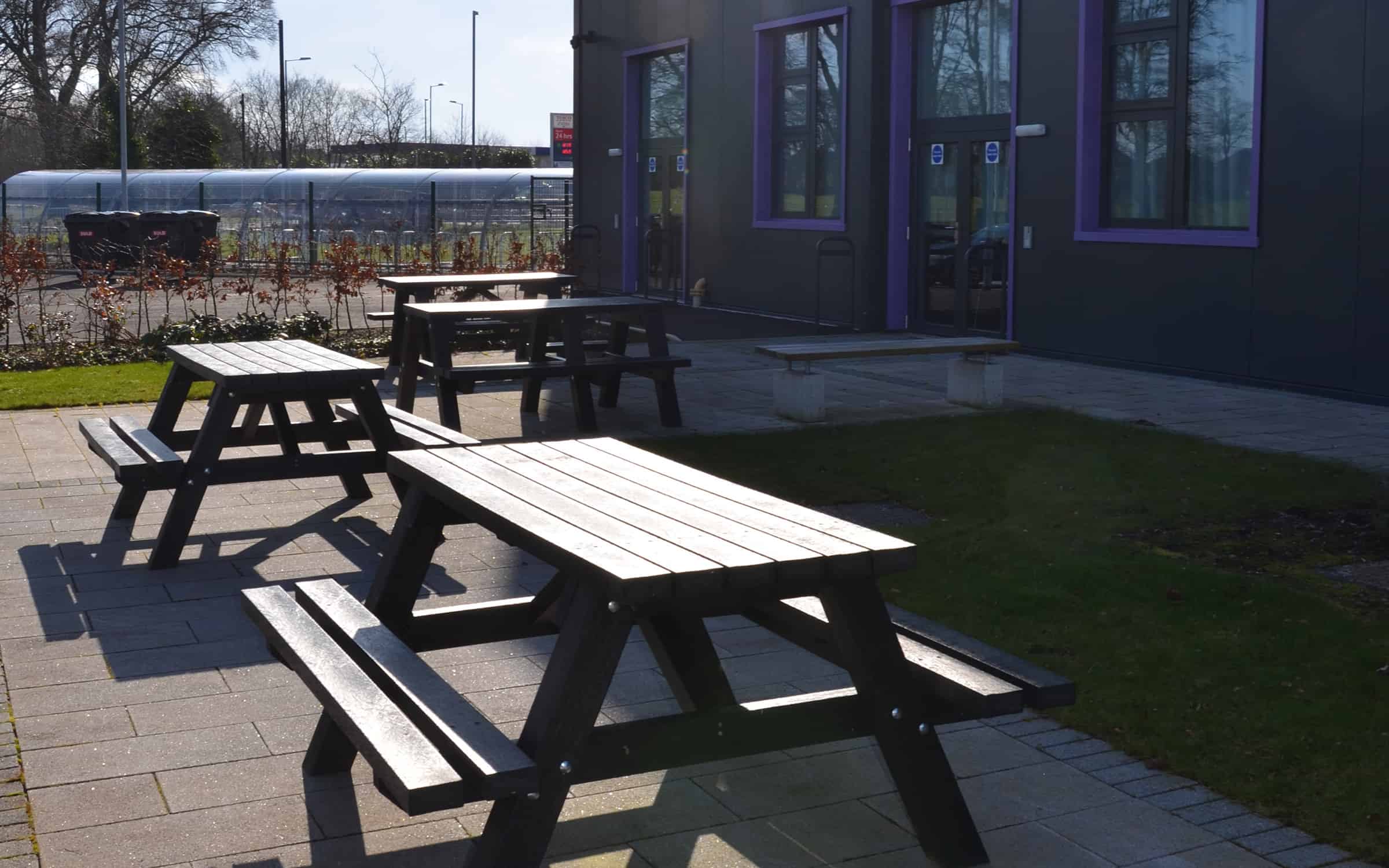 Recycled plastic seating picnic tables in a commercial setting